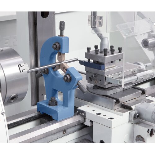 Steady rest with bronze guiding supports long workpieces. 