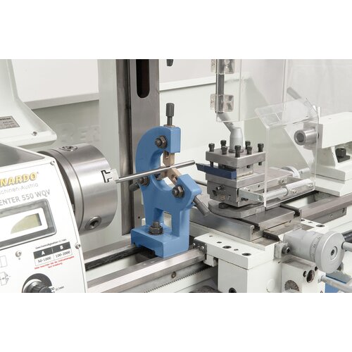 Steady rest with bronze guiding supports long workpieces.