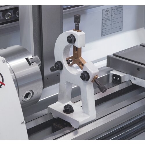 Steady rest with bronze guiding  supports long workpieces. 