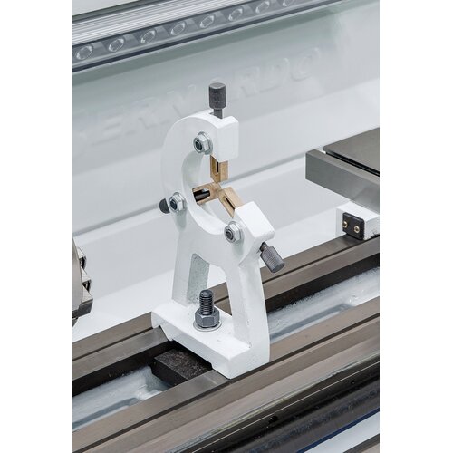Steady rest with bronze guiding supports long workpieces. 