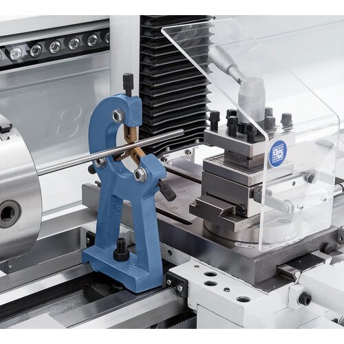 Steady rest with bronze guiding supports long workpieces.