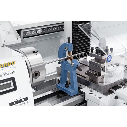 Steady rest with bronze guiding supports long workpieces.