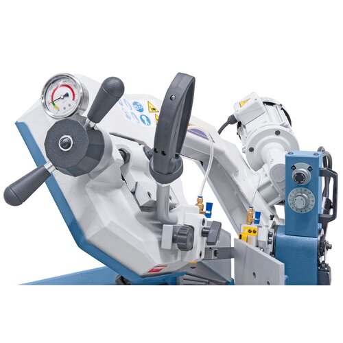 Stepless lowering of the saw frame via regulating valve.