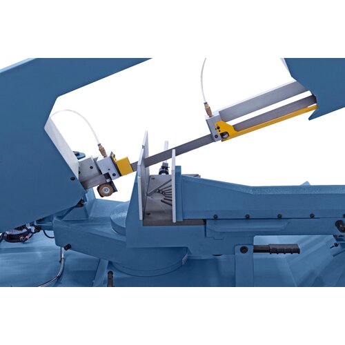Bandsaw blade guiding via combined roll-jaw guide system with carbide inserts.