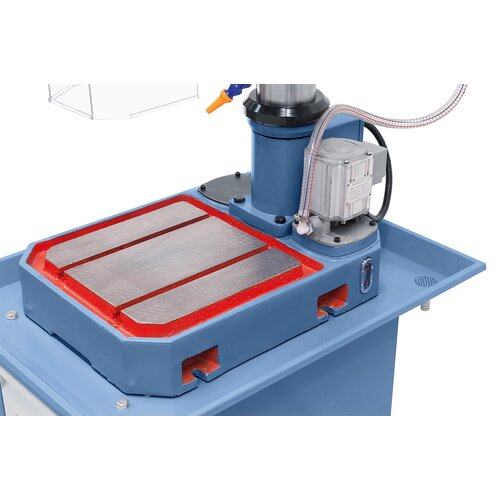 Solid and large machine base features T-slots.