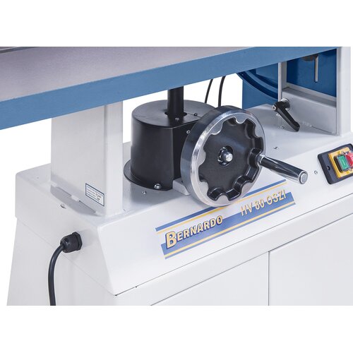 Ergonomically arranged handwheel on front of machine allows for convenient height adjustment of work table.