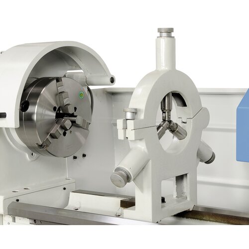 Steady rest with bronze guiding supports long workpieces up to diam. 180 mm.