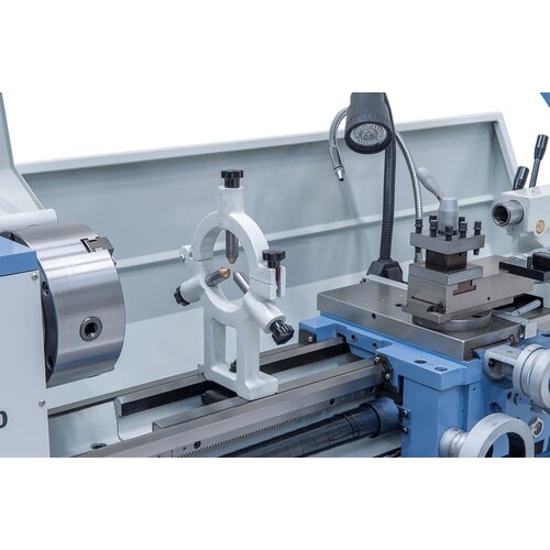 Steady rest with bronze guide to stabilize long workpieces.